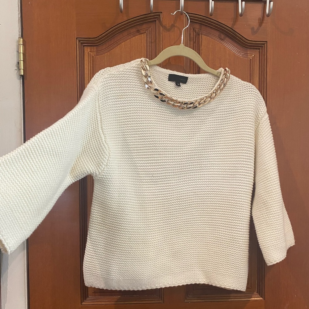 BEAUTIFUL SWEATER WITH GOLD DETAIL ON THE NECKLINE.lightly used